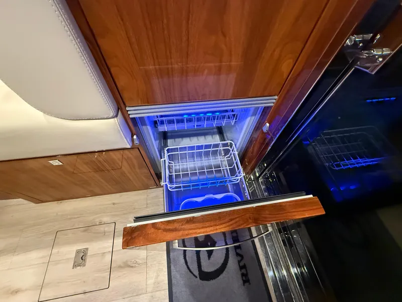 Slide: The Image of Open drawer refrigerator in 2019 Riviera 4800 Sport Yacht interior. - 45