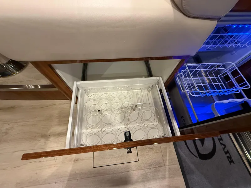 Slide: The Image of Open drawer with glass holders in 2019 Riviera 4800 Sport Yacht interior. - 46