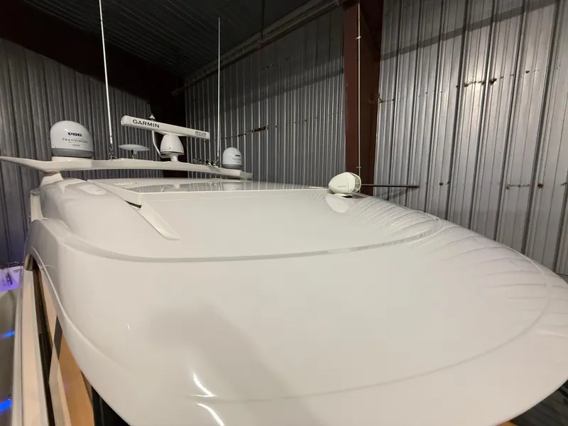 Slide: The Image of 2019 Riviera 4800 Sport Yacht in storage, featuring advanced Garmin navigation equipment. - 5