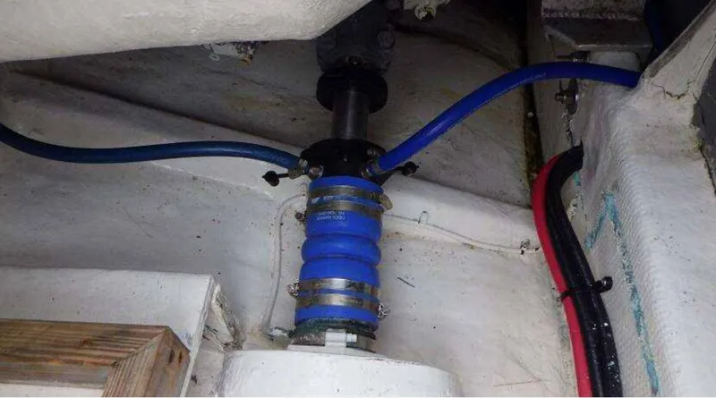 Slide: The Image of Engine compartment of 1995 Blackfin 33 Convertible with blue hoses and fittings. - 11