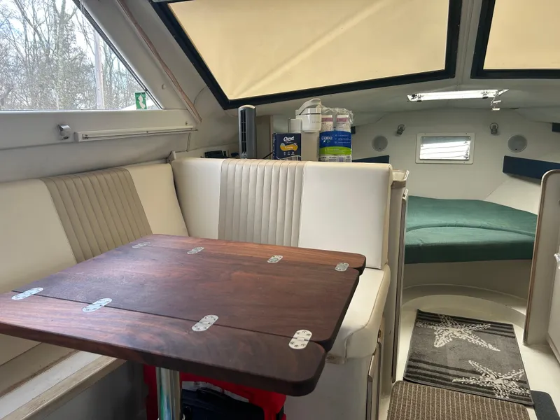 Slide: The Image of Interior of 1995 Blackfin 33 Convertible boat with seating and table. - 12