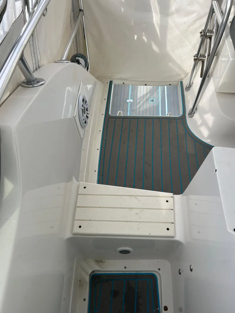Slide: The Image of Interior view of a 1995 Blackfin 33 Convertible boat, featuring sleek design and seating area. - 25