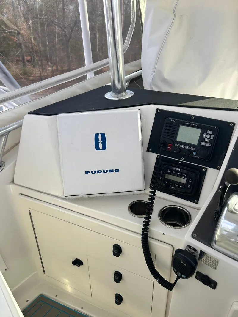 Slide: The Image of 1995 Blackfin 33 Convertible boat dashboard with Furuno navigation equipment. - 29