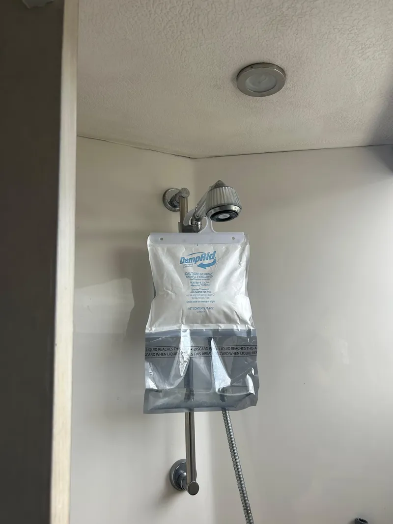 Slide: The Image of Shower area in a 1995 Blackfin 33 Convertible boat. - 32