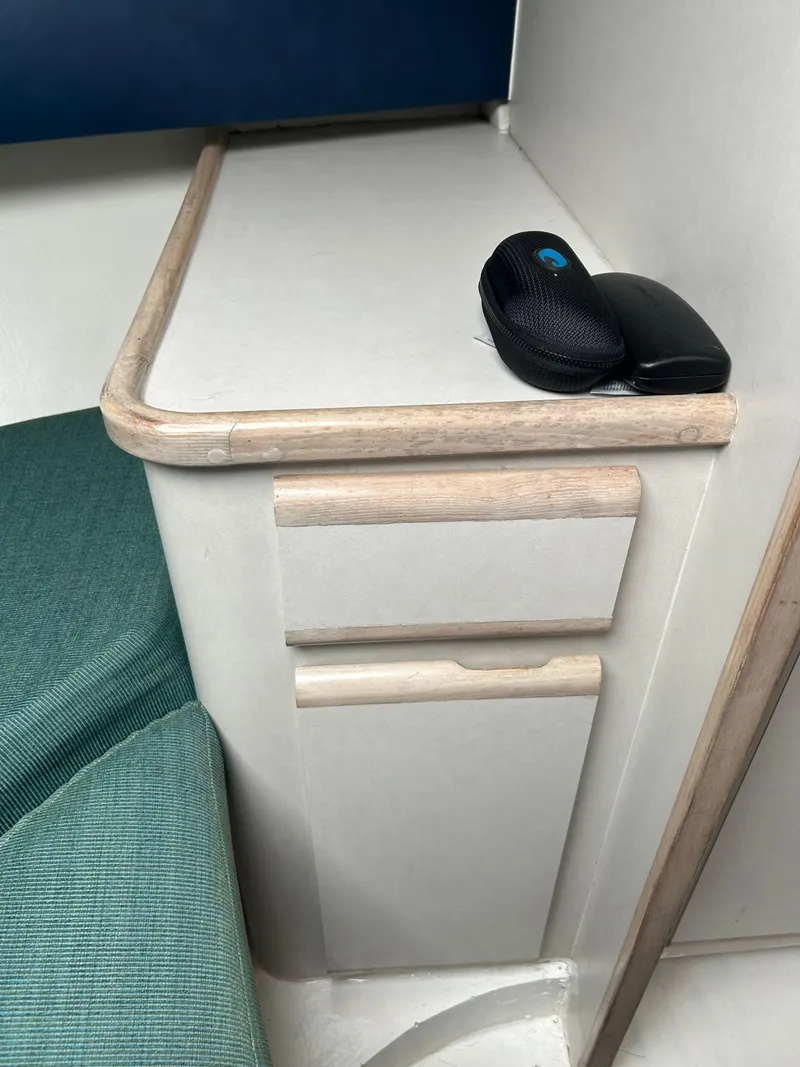 Slide: The Image of Interior of 1995 Blackfin 33 Convertible with storage drawers and a speaker on top. - 34