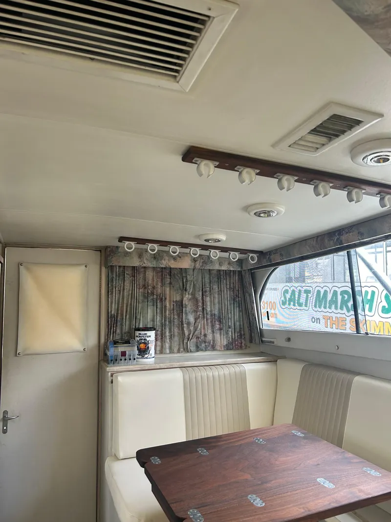 Slide: The Image of Interior of a 1995 Blackfin 33 Convertible boat with seating and table. - 38