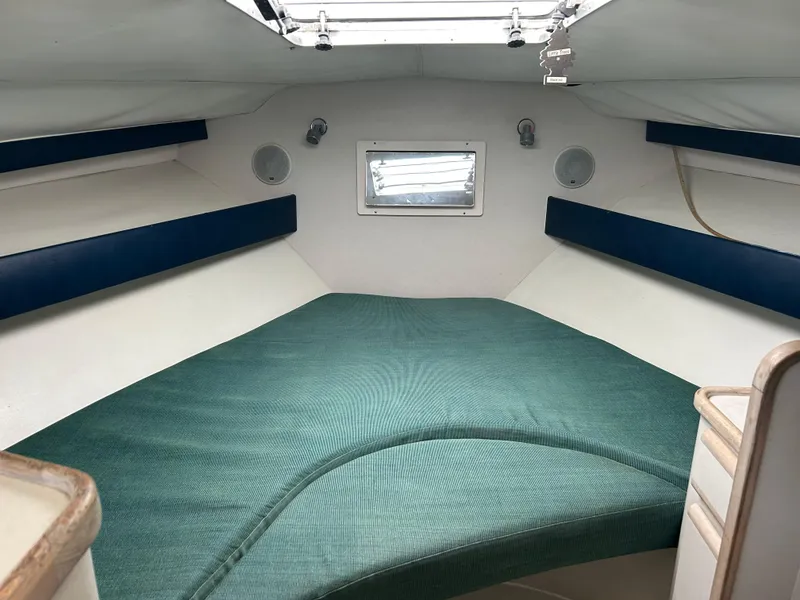 Slide: The Image of Interior cabin of 1995 Blackfin 33 Convertible boat with green bedding. - 39