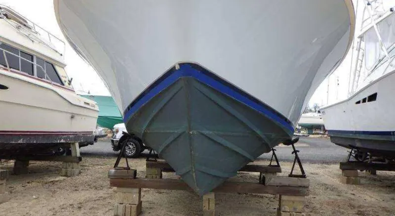Slide: The Image of 1995 Blackfin 33 Convertible boat on dry dock, front view. - 4