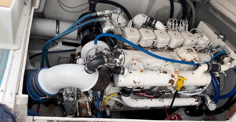 Slide: The Image of Engine compartment of a 1995 Blackfin 33 Convertible boat, showcasing mechanical components. - 44