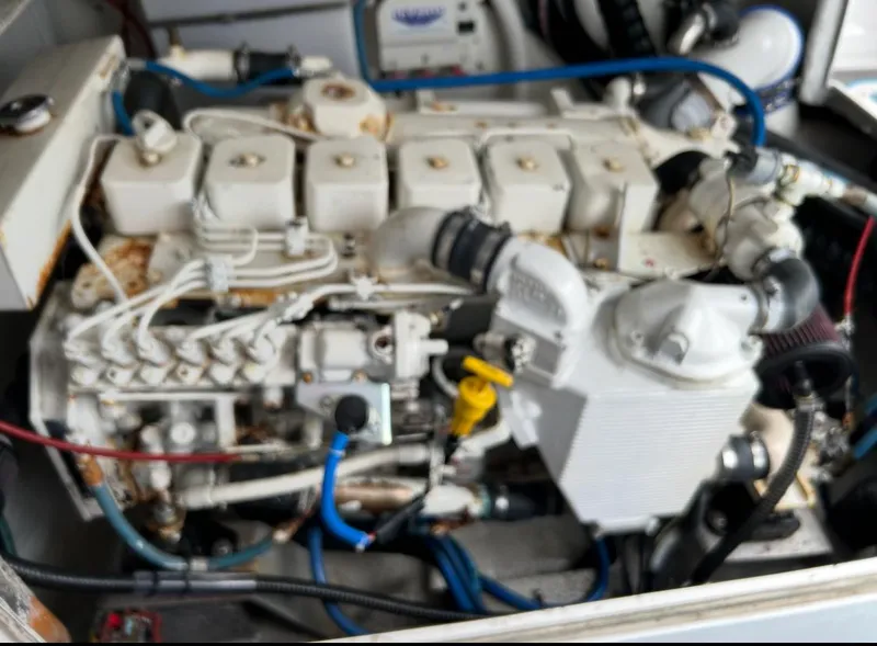 Slide: The Image of Engine of a 1995 Blackfin 33 Convertible boat, featuring complex mechanical components. - 45