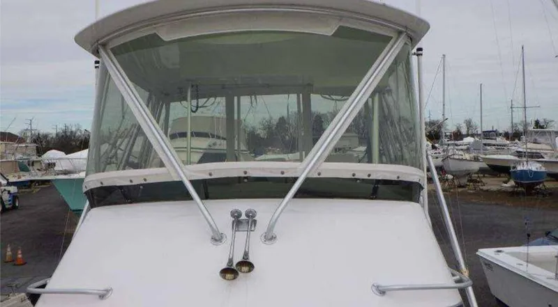 Slide: The Image of 1995 Blackfin 33 Convertible boat docked in a marina. - 8