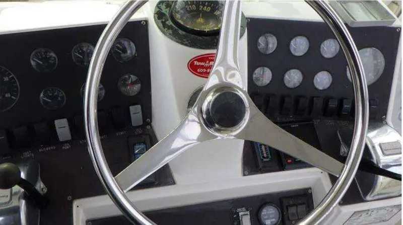 Slide: The Image of Steering wheel and dashboard of a 1995 Blackfin 33 Convertible boat. - 9