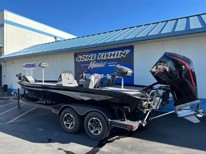 Slide: The Image of 2025 Ranger ALPHA 208 boat on trailer outside a fishing store. - 10
