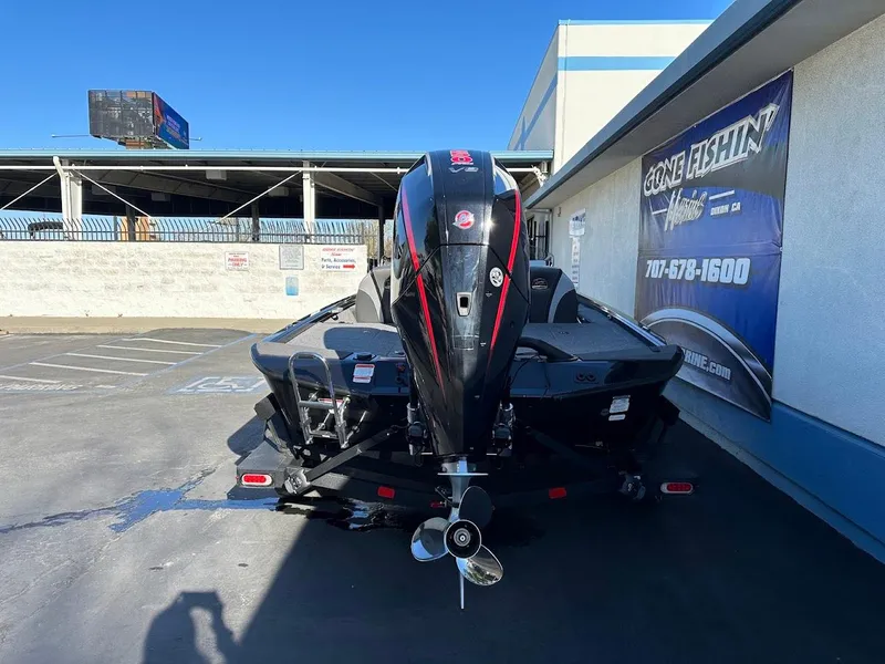 Slide: The Image of 2025 Ranger ALPHA 208 boat parked outside a dealership, rear view. - 11