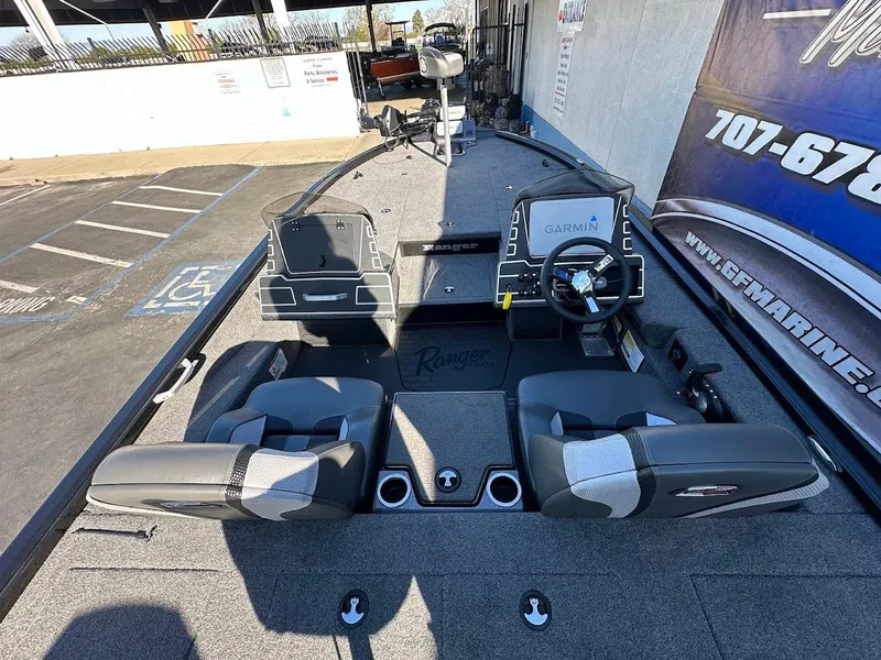 Slide: The Image of 2025 Ranger ALPHA 208 boat interior with dual seats and Garmin navigation system. - 14