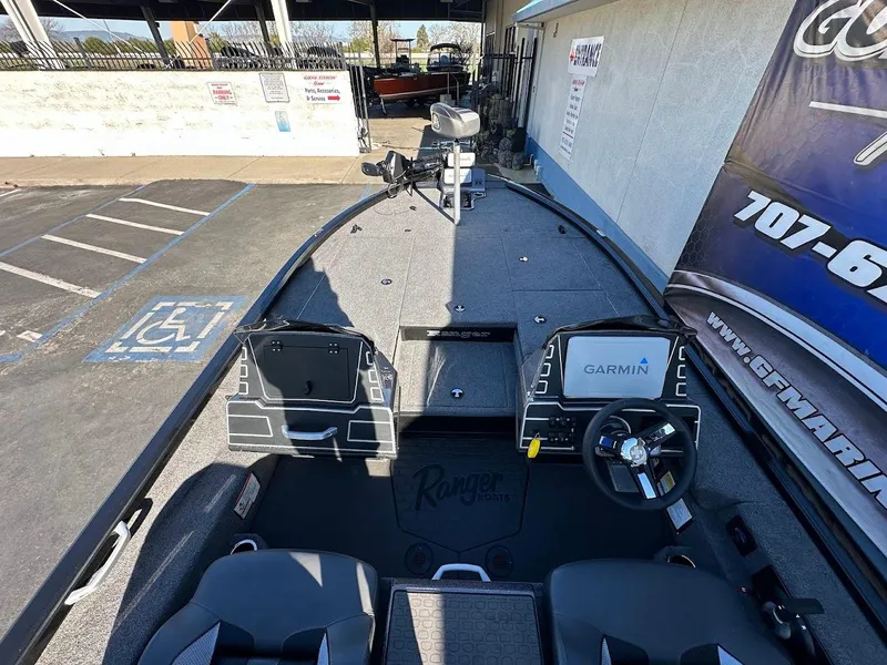 Slide: The Image of 2025 Ranger ALPHA 208 boat interior with Garmin system, parked in a lot. - 15