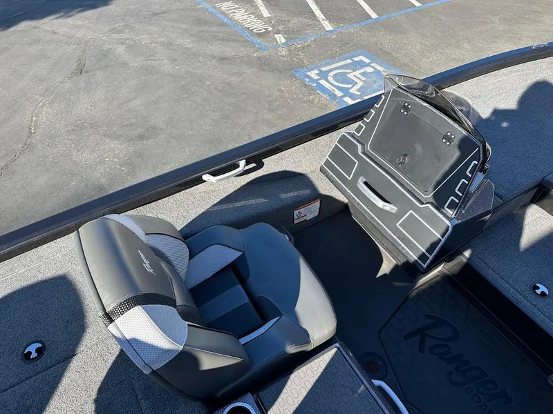 Slide: The Image of 2025 Ranger ALPHA 208 boat interior with seating and control panel. - 16
