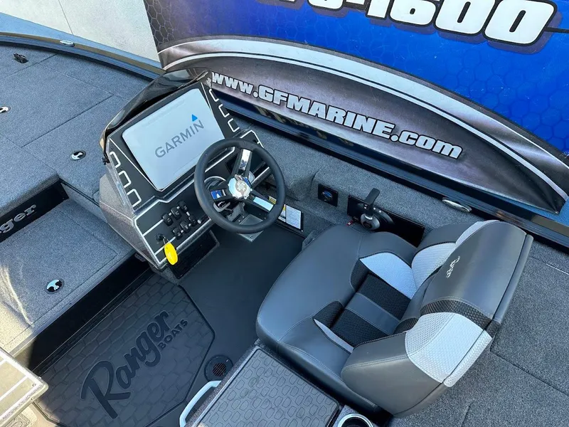 Slide: The Image of 2025 Ranger ALPHA 208 boat cockpit with Garmin navigation system and comfortable seating. - 17