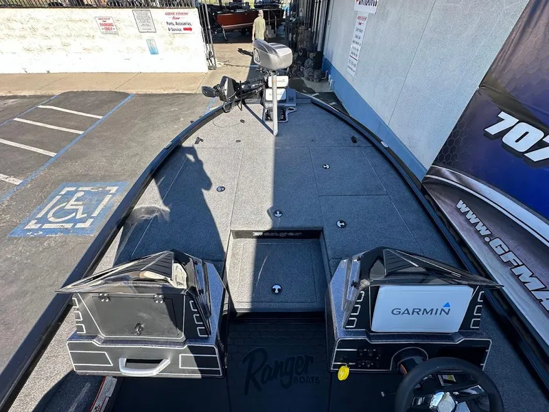 Slide: The Image of 2025 Ranger ALPHA 208 boat with Garmin navigation system, parked in a lot. - 18