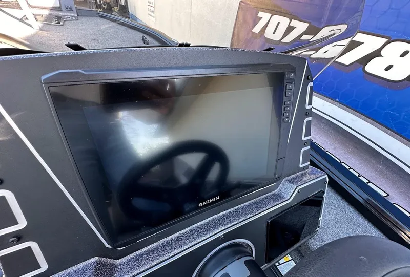Slide: The Image of Dashboard of 2025 Ranger ALPHA 208 with Garmin display and steering wheel. - 19