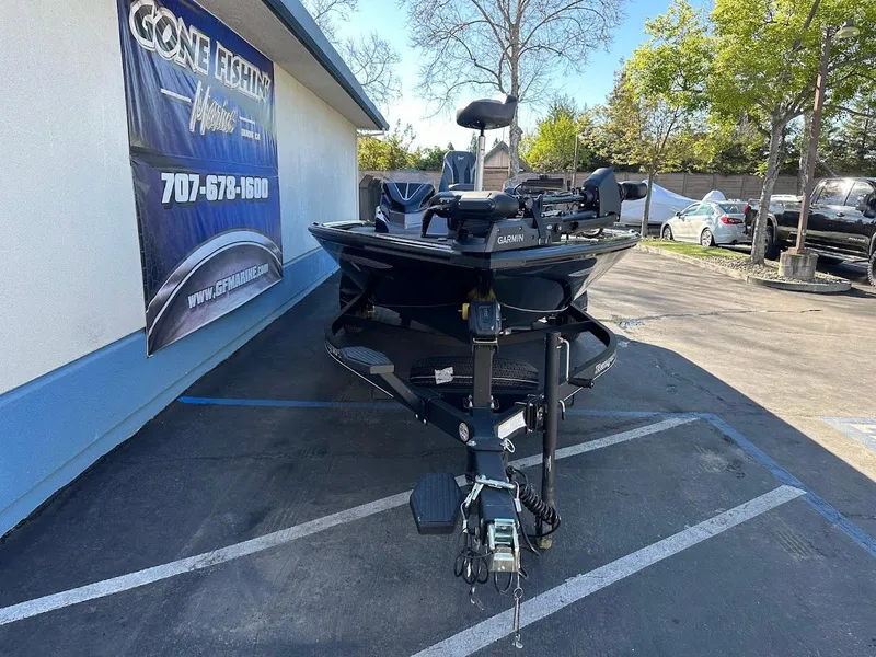 Slide: The Image of 2025 Ranger ALPHA 208 boat parked outside Gone Fishing Marine dealership. - 2
