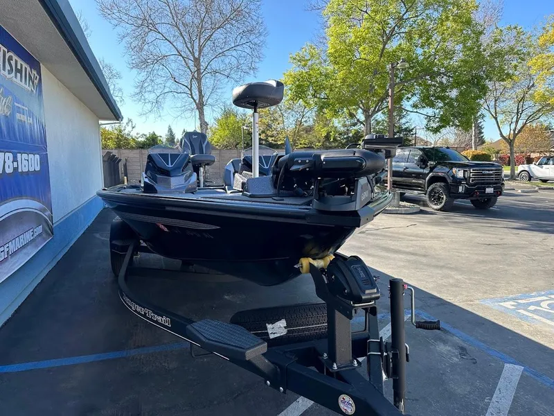 Slide: The Image of 2025 Ranger ALPHA 208 boat on trailer in parking lot, sunny day. - 4
