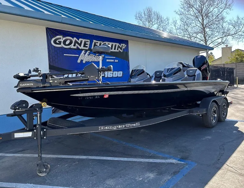 Slide: The Image of 2025 Ranger ALPHA 208 boat on trailer, parked outside a building with a "Gone Fishin'" sign. - 5