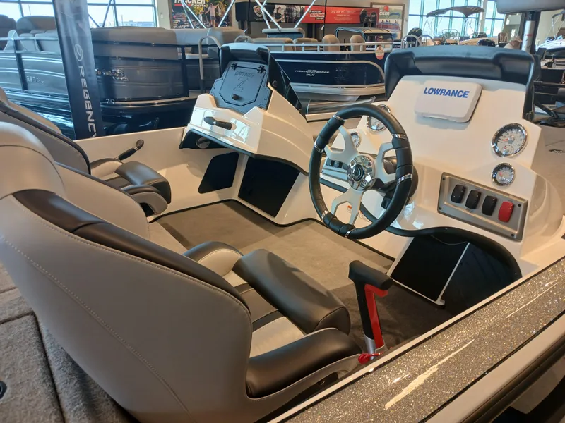 Slide: The Image of 2025 Nitro Z18 boat interior with steering wheel and control panel. - 3