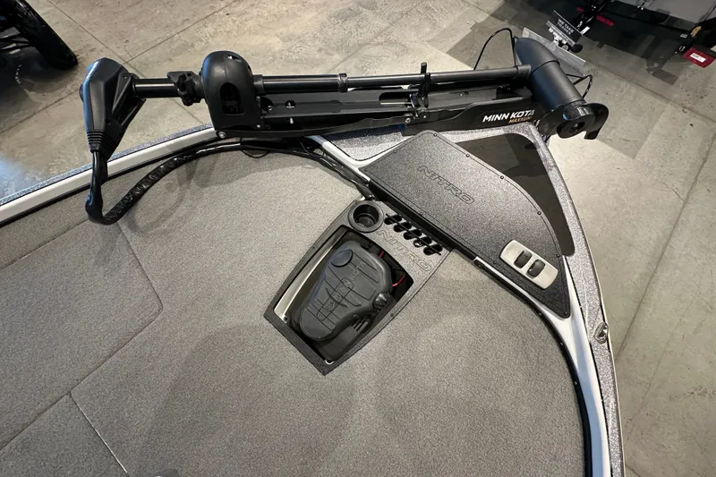 Slide: The Image of 2025 Nitro Z18 boat deck with Minn Kota trolling motor and control panel. - 13