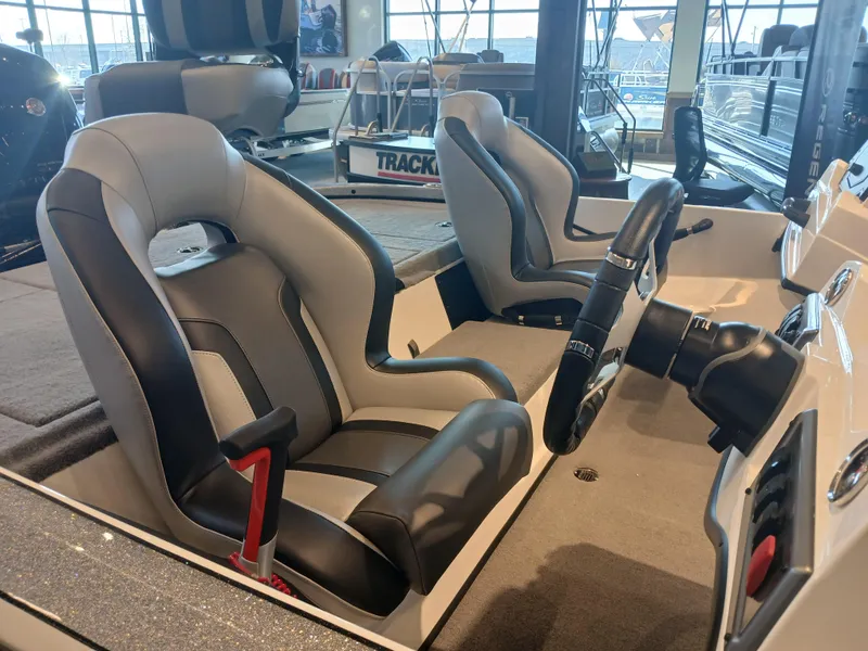 Slide: The Image of 2025 Nitro Z18 boat interior with sleek seats and modern steering wheel. - 5