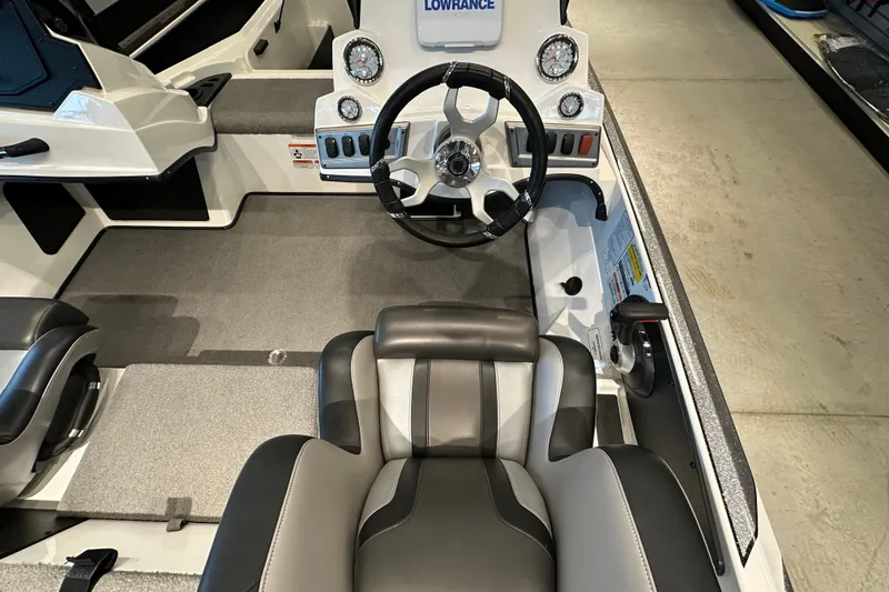 Slide: The Image of Interior of a 2025 Nitro Z18 boat featuring steering wheel and dashboard controls. - 16