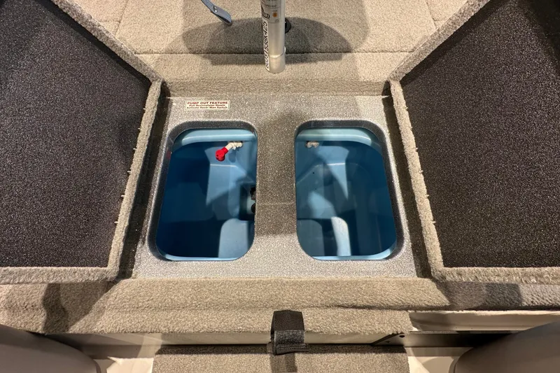 Slide: The Image of 2025 Nitro Z18 boat livewell compartments with pump-out feature. - 15