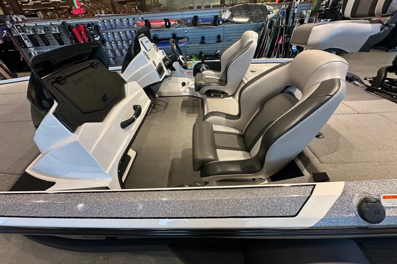 Slide: The Image of 2025 Nitro Z18 boat interior with dual seats and modern dashboard. - 8