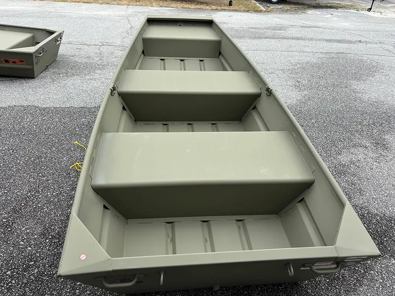 Slide: The Image of 2025 Tracker Grizzly 10 Jon boat, olive green, parked on asphalt. - 2