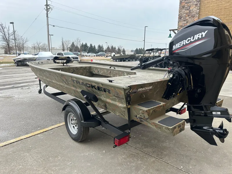 Slide: The Image of 2025 Tracker Grizzly 1654 T Sportsman boat with Mercury engine on trailer. - 4