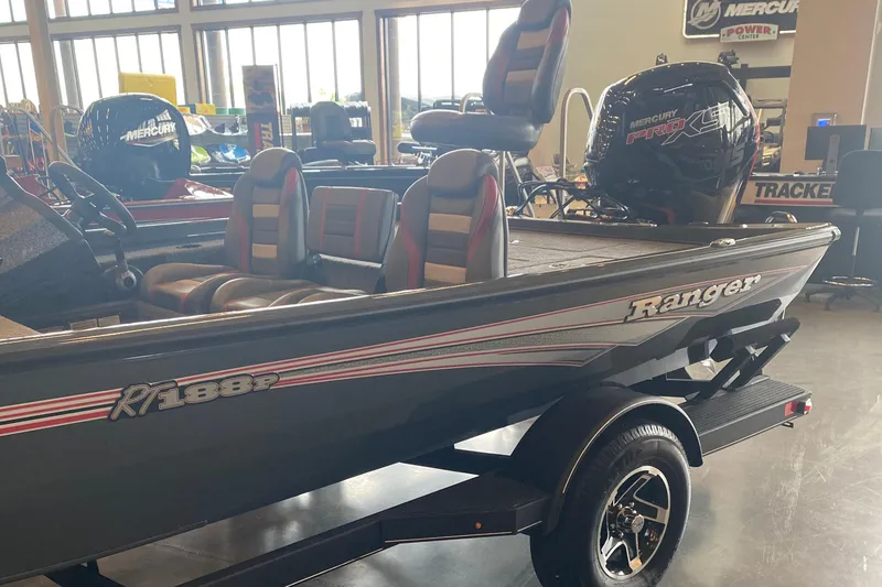 Slide: The Image of 2025 Ranger RT188P fishing boat with Mercury engine in showroom. - 1
