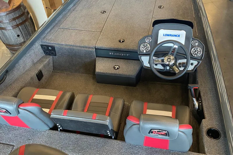 Slide: The Image of 2025 Ranger RT188P boat interior with steering wheel and seating, featuring Lowrance electronics. - 4