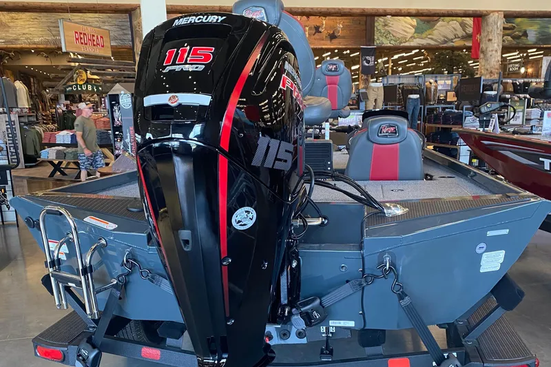 Slide: The Image of 2025 Ranger RT188P boat with Mercury 115 Pro XS engine displayed indoors. - 6