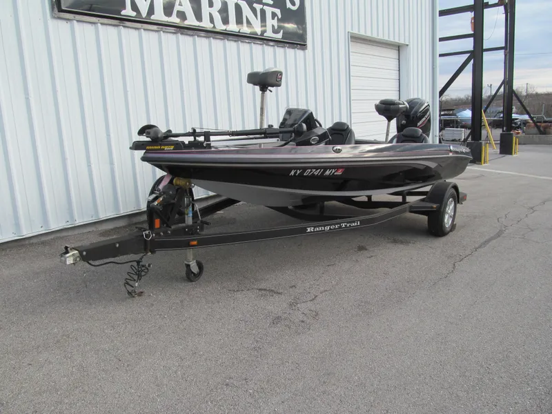 Slide: The Image of 2016 Ranger Z175 boat on trailer parked outside a marine shop. - 1