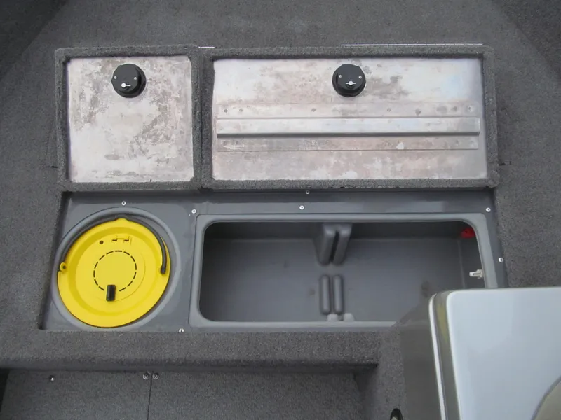 Slide: The Image of 2018 Tracker Pro Guide V-16 SC boat storage compartments with yellow hatch and gray interior. - 10