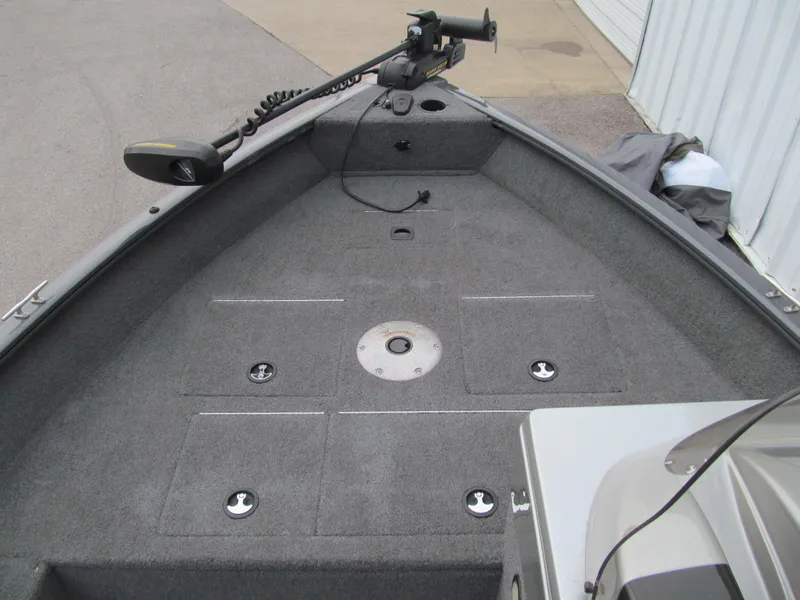 Slide: The Image of 2018 Tracker Pro Guide V-16 SC boat deck with trolling motor and storage compartments. - 7