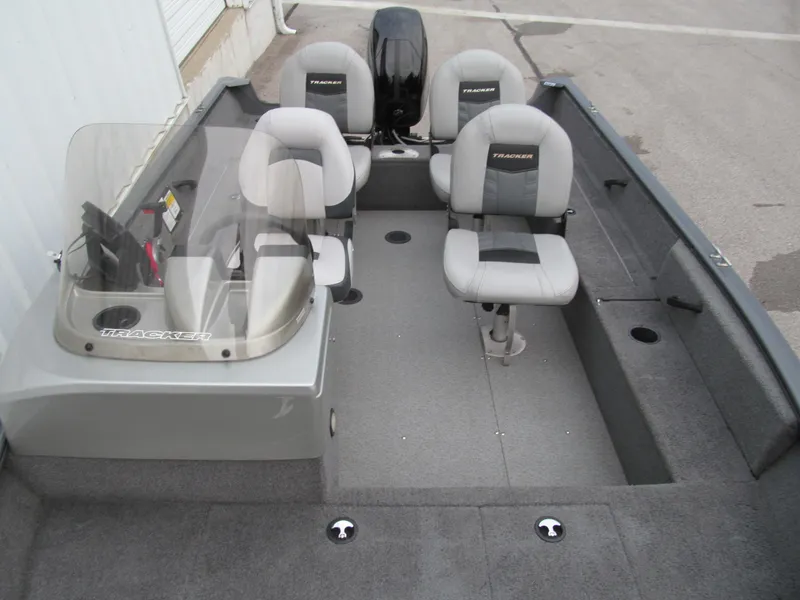 Slide: The Image of 2018 Tracker Pro Guide V-16 SC boat interior with seating and console. - 9