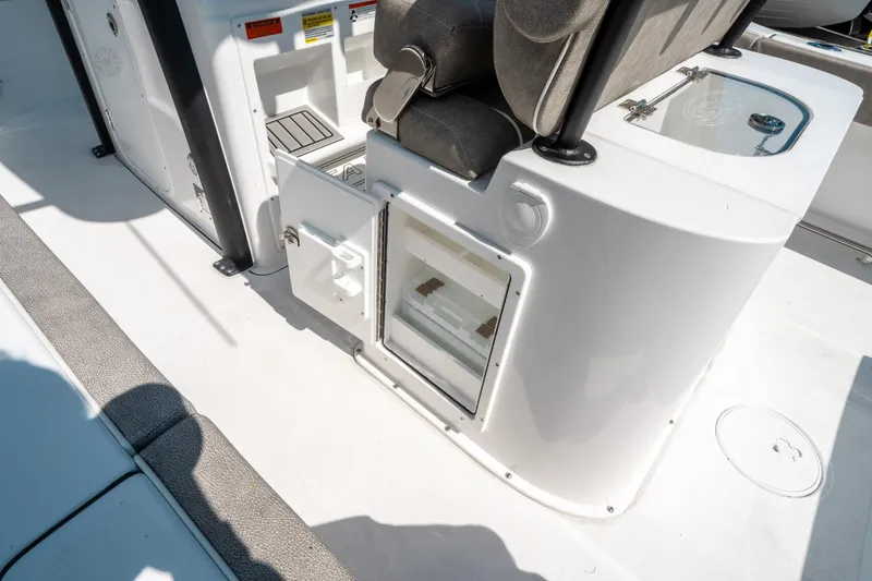 Slide: The Image of 2025 Sea Hunt Gamefish 25 boat interior with open storage compartment and seating. - 20