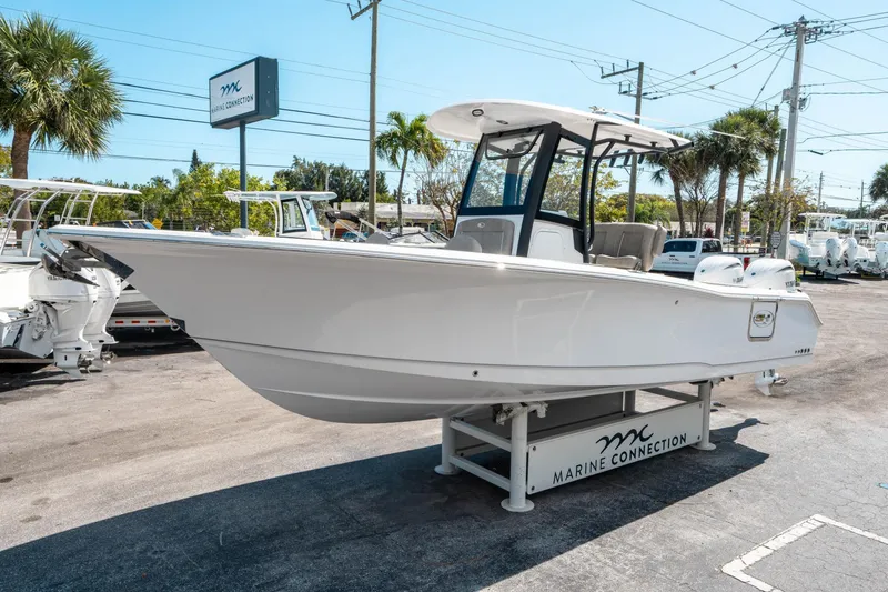Slide: The Image of 2025 Sea Hunt Gamefish 25 boat displayed at Marine Connection dealership. - 6