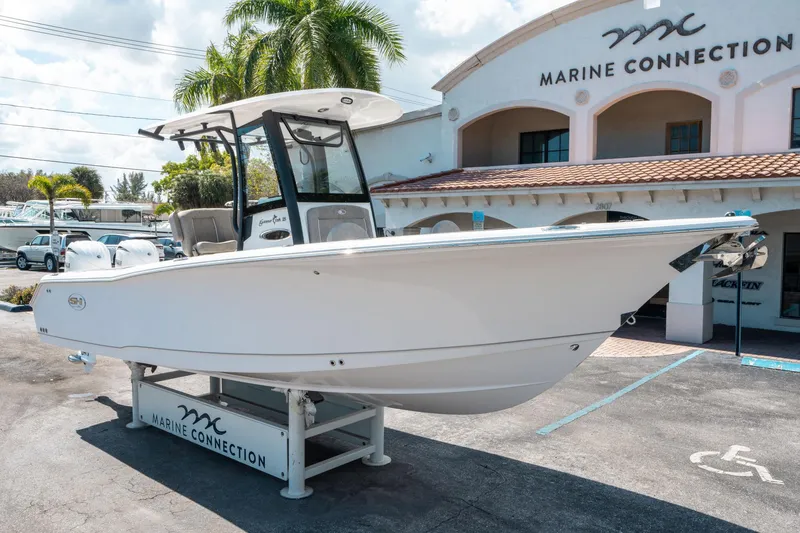 Slide: The Image of 2025 Sea Hunt Gamefish 25 boat displayed at Marine Connection dealership. - 8