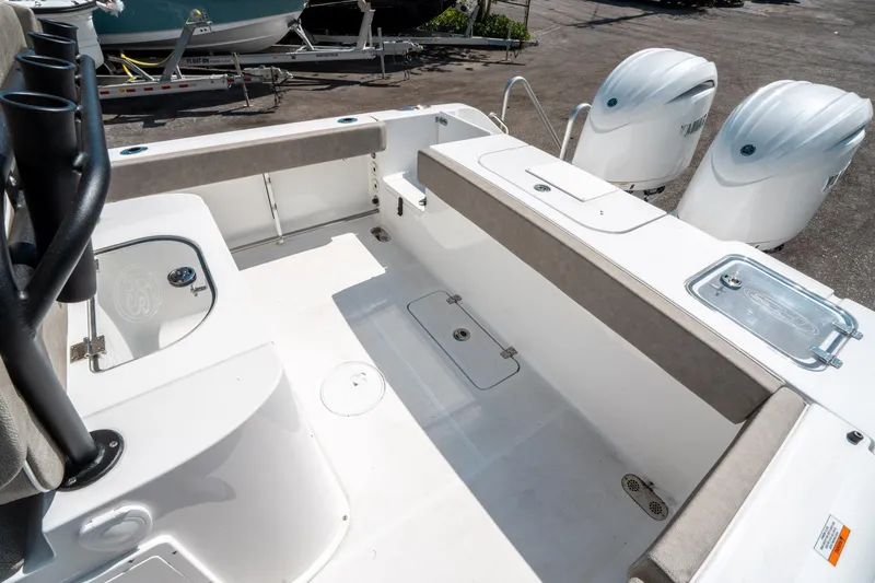 Slide: The Image of 2025 Sea Hunt Gamefish 25 boat interior with dual engines and spacious deck layout. - 11