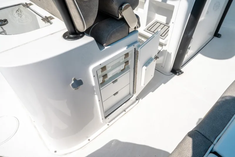 Slide: The Image of 2025 Sea Hunt Gamefish 25 boat interior with open storage compartment. - 21