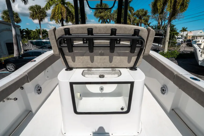 Slide: The Image of 2025 Sea Hunt Gamefish 25 boat interior with rod holders and storage compartment. - 16