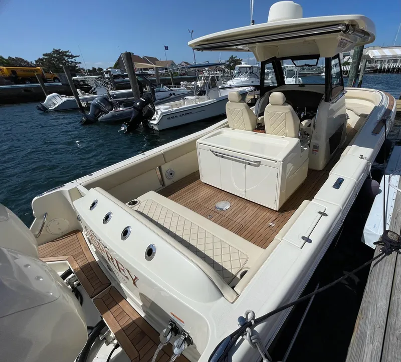 Slide: The Image of 2019 Chris-Craft Catalina 34 helm with navigation display, steering wheel, and controls. - 7