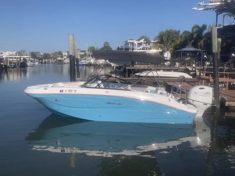 The Image of 2025 Hurricane SD 2050 boat docked in a serene marina setting. - 0